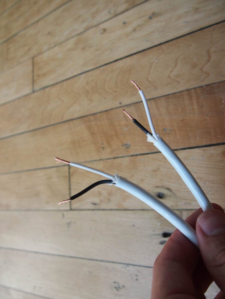 1     Cut both ends of the white power cord exterior shell and interior wires to look as pictured. Make sure this is done delicately and cleanly, so no metal wire is cut/exposed except at the ends.