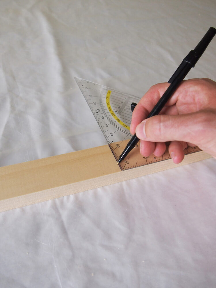 1     Measure a length of wood at 18.5in (47cm) long and mark a line with your square tool.