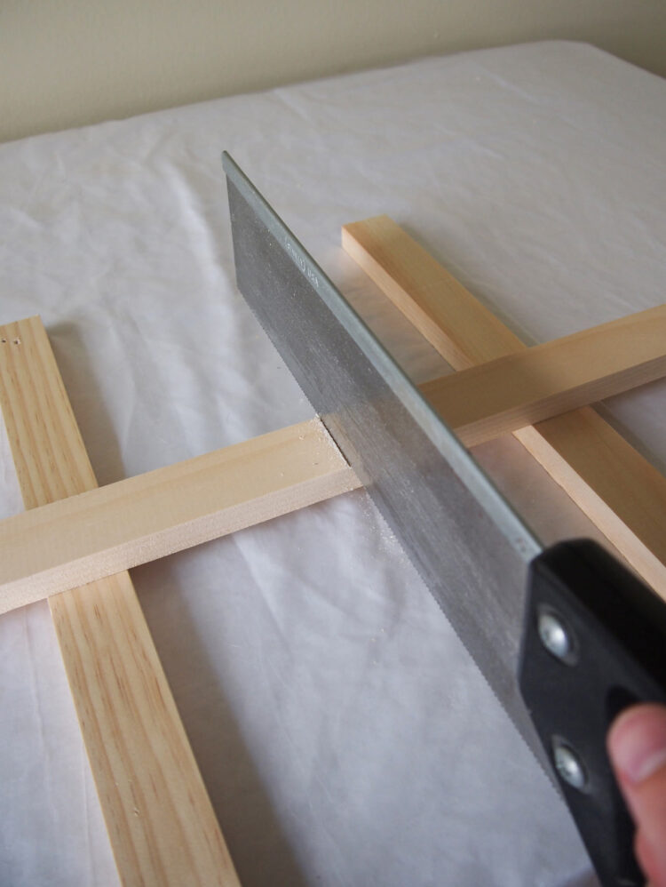 2     Elevate the wood from the table and saw along the line you just made. Repeat step 1 and 2 until you have 30 pieces (31 pieces if using 18mm x 34mm wood).