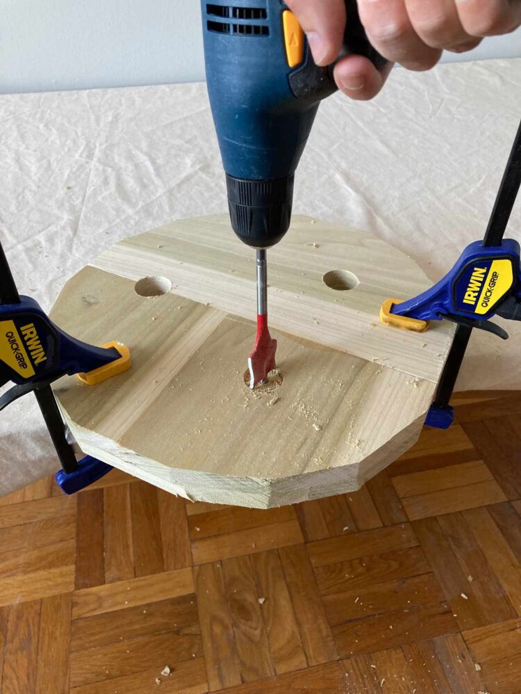 8     Use caution with this step. With two firm hands on the drill, drill 3 holes through the top of the seat and out the bottom of the seat. Each hole angled outward.